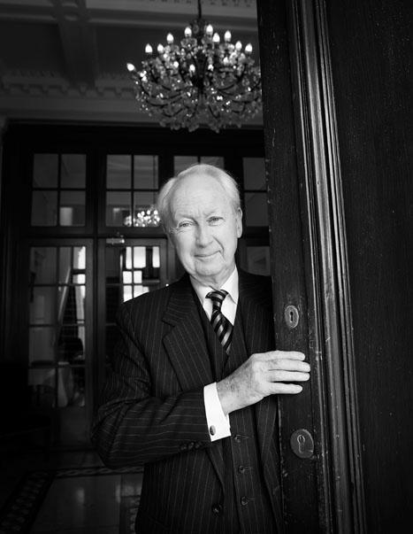 Dr. Ed Walsh former President of the University of Limerick, posing at the door of the White House on the grounds of University of Limerick.  